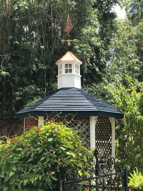 montgomery cupola with sail boat weathervane on a green gazebo