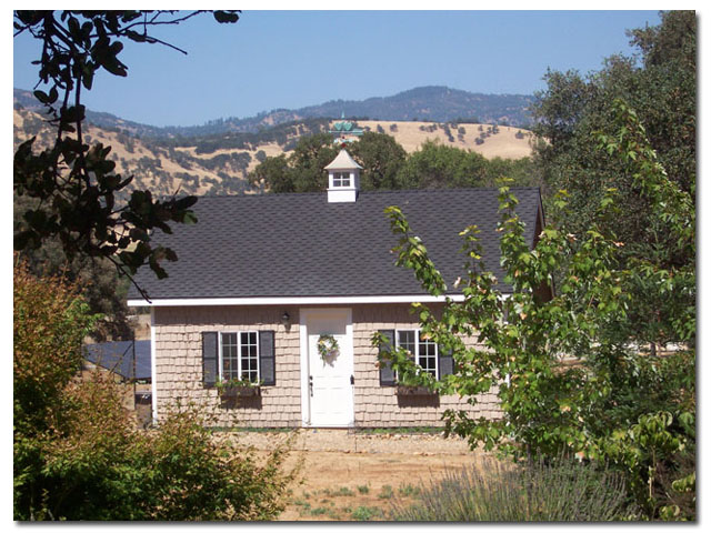 cupola with arrow weathervane on a small building