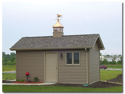 pagoda cupola with horse weathervane on a shed