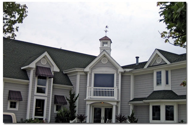 custom cupola with mermaid weathervane on large home