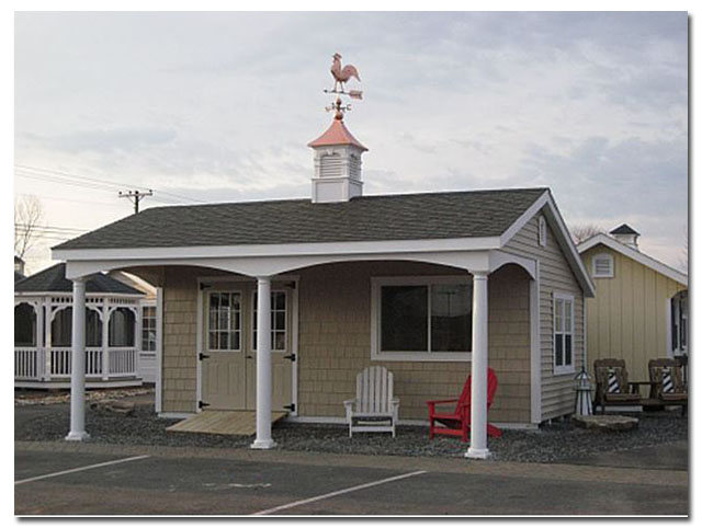 cupola with rooster on a shed with porch